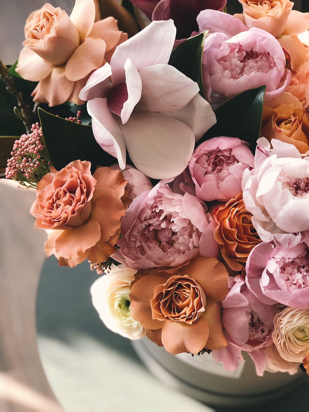 Lush coral and pink peony arrangement for events